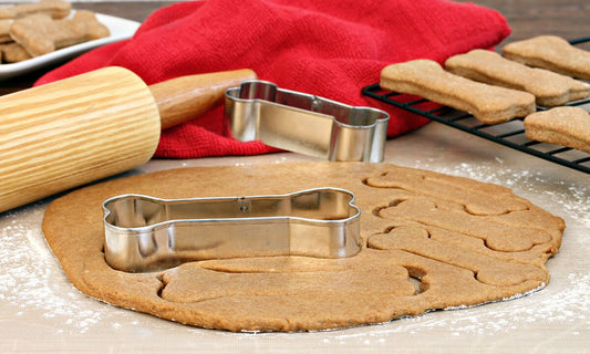 dog biscuit dough with bone shaped cookie cutter